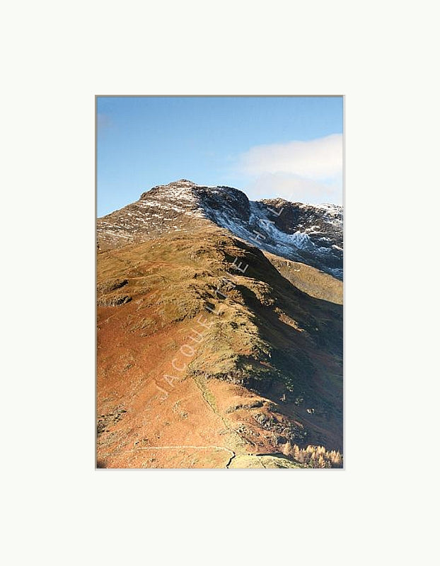 photograph of the beautiful and imposing rich autumnal colours of the Band", Great Langdale, Lake District. Shown with a white mount
